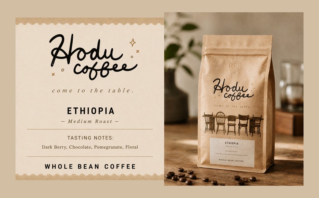 Hodu Coffee — Ethiopia, whole bean. Label with tasting notes: dark berry, chocolate, pomegranate, floral — beside the kraft coffee bag